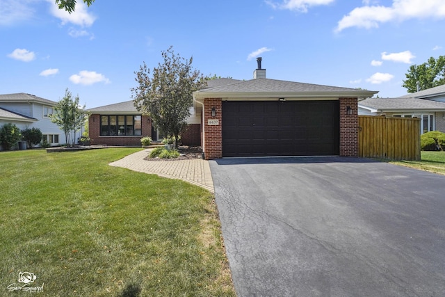 16637 W Oneida Dr, Lockport, IL 60441 - view of front of home with brick siding, driveway, a garage, and a chimney