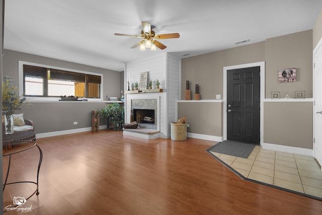 16637 W Oneida Dr, Lockport, IL 60441 - living area featuring ceiling fan, wood finished floors, and a tile fireplace