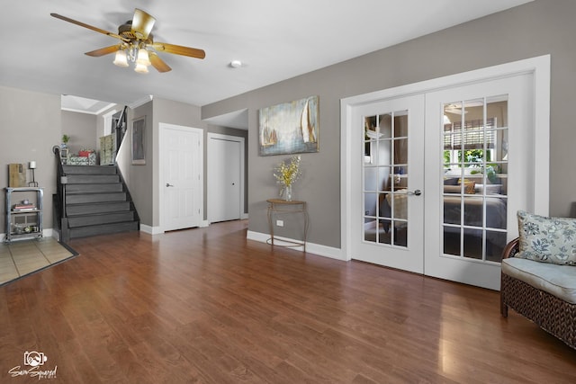 16637 W Oneida Dr, Lockport, IL 60441 - unfurnished living room featuring french doors, wood finished floors, a ceiling fan, and stairs