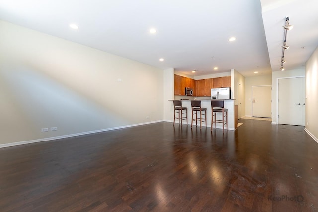 915 S Oak Park Ave Unit 1B, Oak Park, IL 60304 - living area with dark wood finished floors, recessed lighting, and track lighting