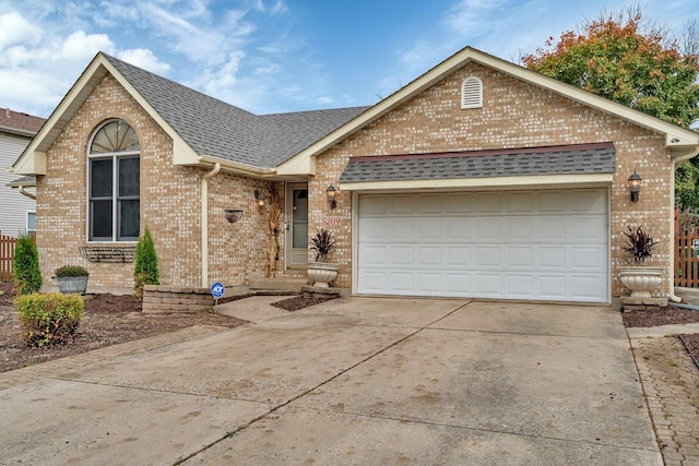 5209 Meadowbrook St, Plainfield, IL 60586 - ranch-style house featuring concrete driveway, roof with shingles, brick siding, and a garage