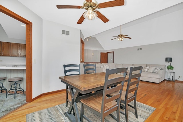 5209 Meadowbrook St, Plainfield, IL 60586 - dining space featuring ceiling fan, light wood finished floors, and vaulted ceiling