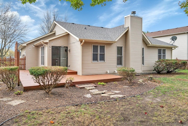 5209 Meadowbrook St, Plainfield, IL 60586 - rear view of house featuring a shingled roof, a wooden deck, and a chimney