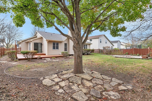 5209 Meadowbrook St, Plainfield, IL 60586 - back of property featuring a fenced backyard, a wooden deck, and a chimney