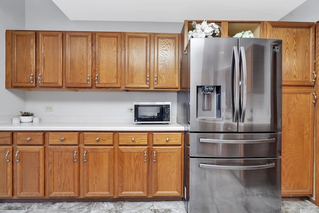 5209 Meadowbrook St, Plainfield, IL 60586 - kitchen featuring stainless steel fridge with ice dispenser, brown cabinets, and light countertops