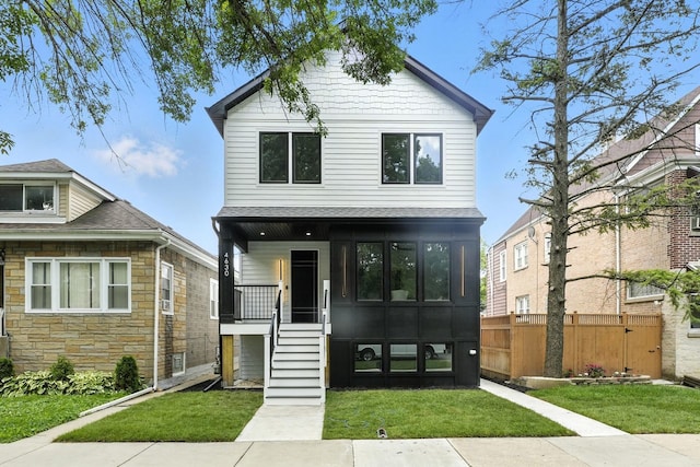4630 N Kasson Ave, Chicago, IL 60630 - view of front of house featuring a porch, stone siding, a shingled roof, and stairs