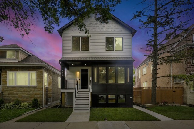 4630 N Kasson Ave, Chicago, IL 60630 - modern home with covered porch, stairs, and stone siding