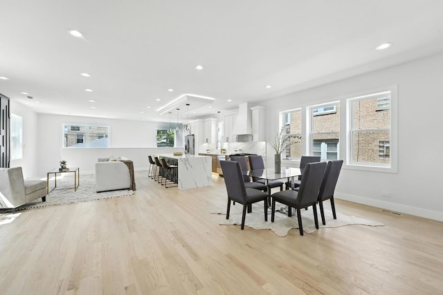 4630 N Kasson Ave, Chicago, IL 60630 - dining room featuring light wood-style flooring, recessed lighting, and healthy amount of natural light
