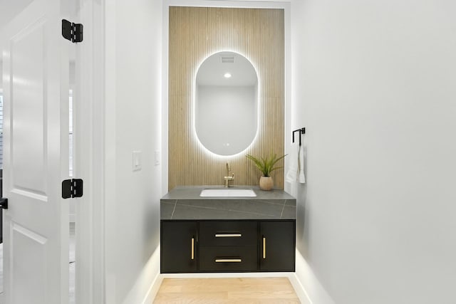 4630 N Kasson Ave, Chicago, IL 60630 - bathroom featuring vanity and wood finished floors