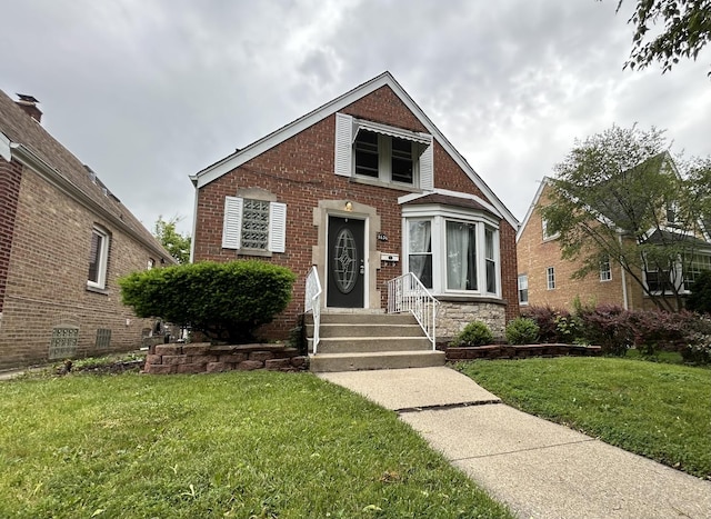 1636 N 75th Ave, Elmwood Park, IL 60707 - bungalow-style home featuring a front lawn, brick siding, and entry steps