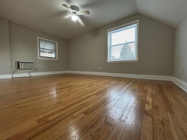 1636 N 75th Ave, Elmwood Park, IL 60707 - additional living space featuring a wall unit AC, lofted ceiling, wood finished floors, and a ceiling fan