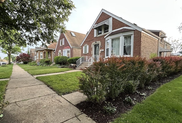 1636 N 75th Ave, Elmwood Park, IL 60707 - view of front of property with brick siding and a front lawn