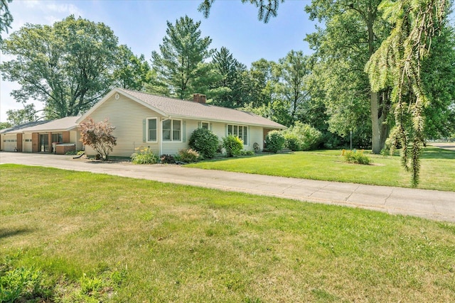 609 S Park St, Paxton, IL 60957 - single story home featuring a chimney, a front yard, and driveway