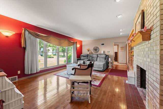 609 S Park St, Paxton, IL 60957 - living room with a fireplace and hardwood / wood-style floors