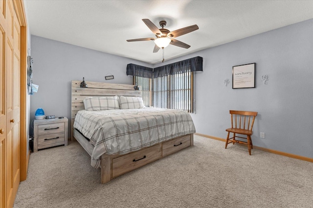 609 S Park St, Paxton, IL 60957 - carpeted bedroom featuring baseboards and ceiling fan