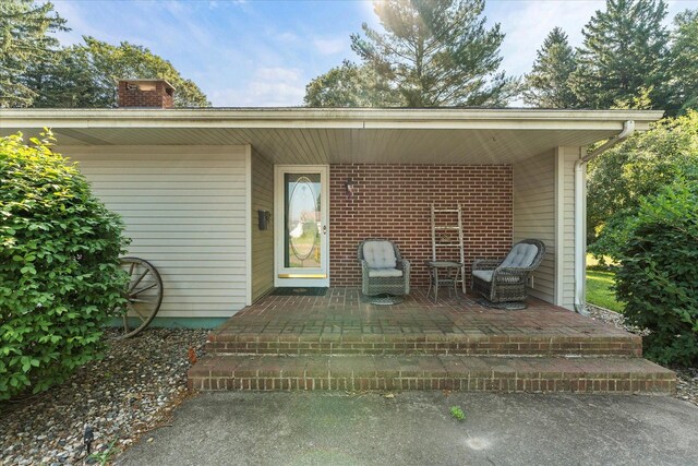 609 S Park St, Paxton, IL 60957 - entrance to property with a chimney and a patio area