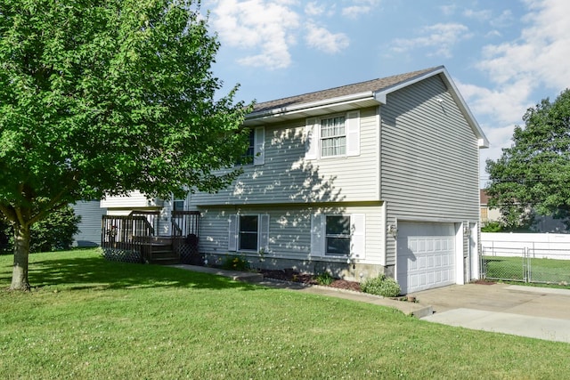 1409 N Nixon Dr, Pontiac, IL 61764 - view of front of property with an attached garage, concrete driveway, and a wooden deck