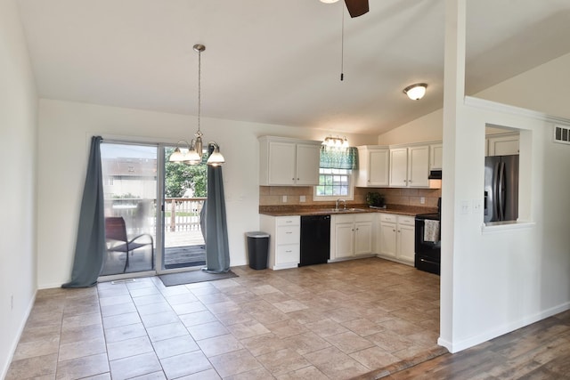 1409 N Nixon Dr, Pontiac, IL 61764 - kitchen featuring black appliances, tasteful backsplash, vaulted ceiling, white cabinetry, and a chandelier