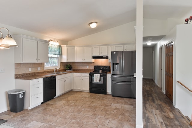 1409 N Nixon Dr, Pontiac, IL 61764 - kitchen featuring black appliances, lofted ceiling, under cabinet range hood, decorative backsplash, and white cabinetry
