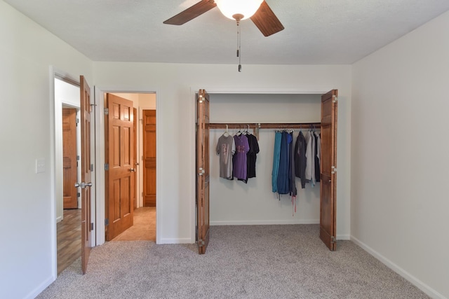 1409 N Nixon Dr, Pontiac, IL 61764 - unfurnished bedroom featuring carpet flooring, a closet, and ceiling fan