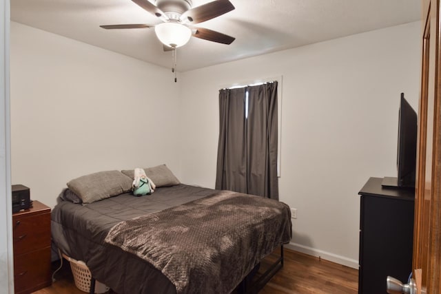 1409 N Nixon Dr, Pontiac, IL 61764 - bedroom with dark wood-style floors and a ceiling fan