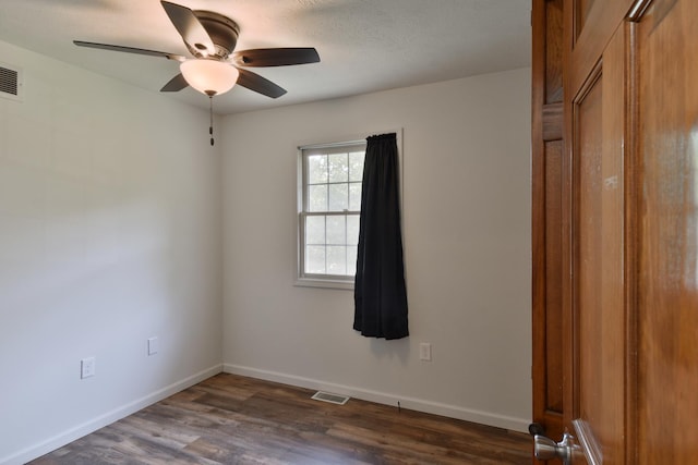 1409 N Nixon Dr, Pontiac, IL 61764 - unfurnished room with ceiling fan and dark wood-type flooring