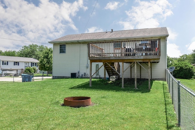 1409 N Nixon Dr, Pontiac, IL 61764 - rear view of property with a wooden deck and stairway