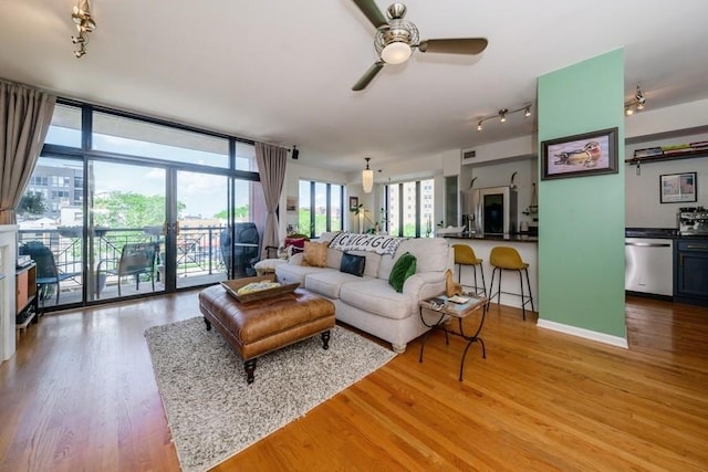 3232 N Halsted St Unit D412, Chicago, IL 60657 - living area featuring ceiling fan, light wood-style flooring, track lighting, and floor to ceiling windows