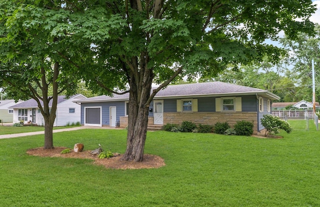 809 S Longview Rd, Monticello, IL 61856 - ranch-style house featuring stone siding, driveway, and a garage