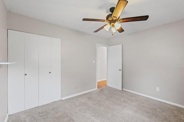 809 S Longview Rd, Monticello, IL 61856 - unfurnished bedroom featuring carpet floors, a closet, and ceiling fan