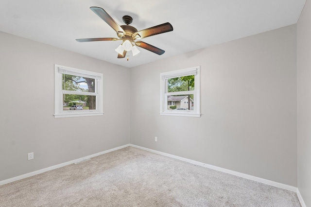809 S Longview Rd, Monticello, IL 61856 - carpeted spare room featuring baseboards and ceiling fan