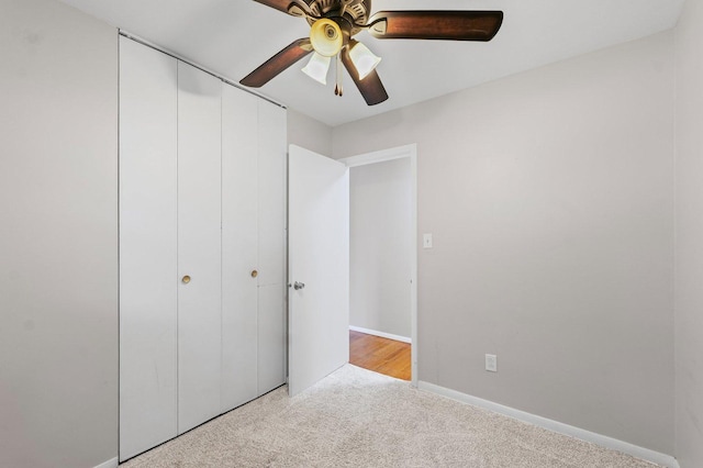 809 S Longview Rd, Monticello, IL 61856 - unfurnished bedroom with carpet, a closet, and ceiling fan