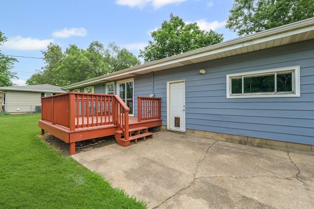 809 S Longview Rd, Monticello, IL 61856 - rear view of house with a lawn, a wooden deck, and a patio