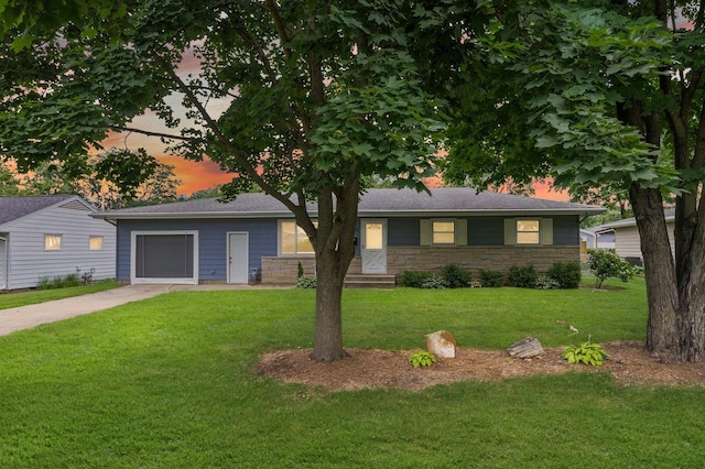 809 S Longview Rd, Monticello, IL 61856 - single story home with concrete driveway, a lawn, a garage, and stone siding