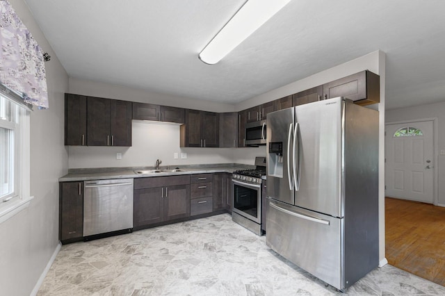 809 S Longview Rd, Monticello, IL 61856 - kitchen with stainless steel appliances, dark brown cabinets, and light countertops