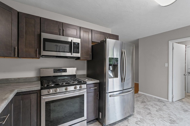 809 S Longview Rd, Monticello, IL 61856 - kitchen featuring stainless steel appliances, dark brown cabinetry, and light countertops
