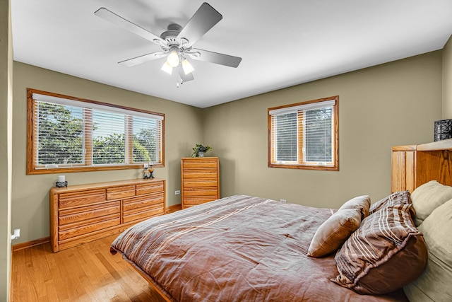 8353 Arrowhead Ln, Orland Park, IL 60462 - bedroom with light wood-style flooring and ceiling fan