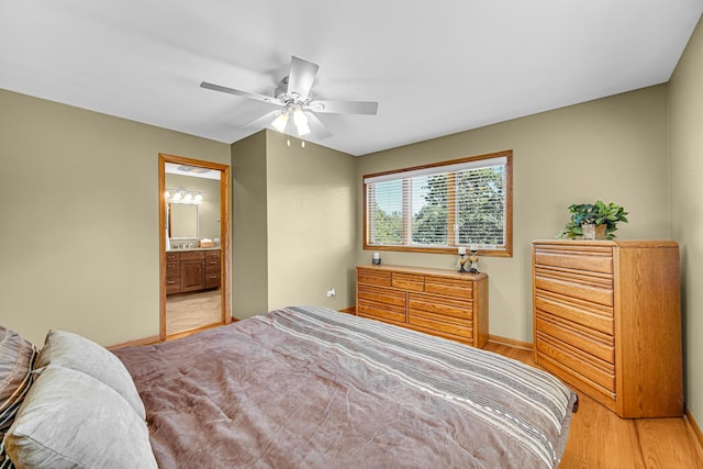 8353 Arrowhead Ln, Orland Park, IL 60462 - bedroom with light wood-type flooring, a ceiling fan, and ensuite bath