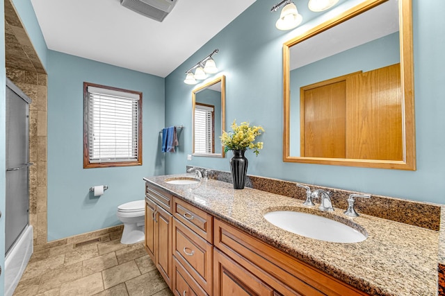 8353 Arrowhead Ln, Orland Park, IL 60462 - bathroom with double vanity, bath / shower combo with glass door, and stone finish flooring