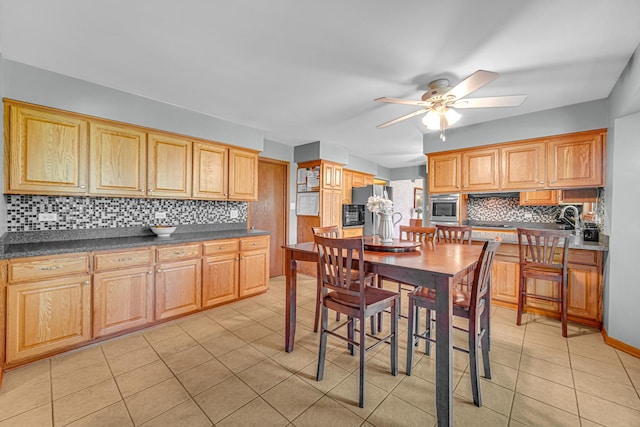 8353 Arrowhead Ln, Orland Park, IL 60462 - kitchen featuring a ceiling fan, decorative backsplash, light tile patterned floors, stainless steel refrigerator with ice dispenser, and dark countertops