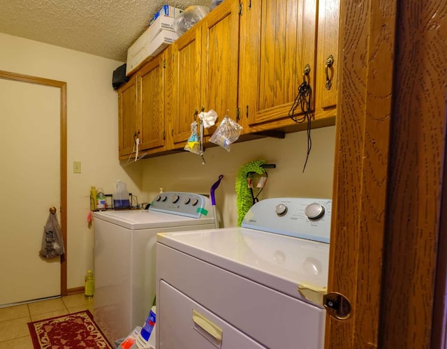 921 Shagbark Rd Unit 921, New Lenox, IL 60451 - laundry area with independent washer and dryer, cabinet space, light tile patterned floors, and a textured ceiling