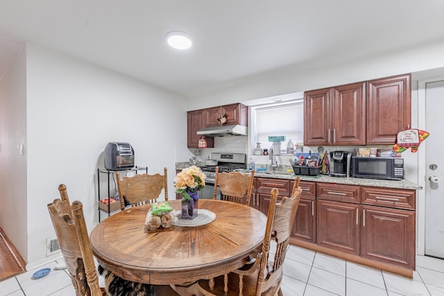 2958 S Lowe Ave, Chicago, IL 60616 - dining area featuring light tile patterned floors