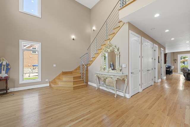 23 S Elm St, Palatine, IL 60067 - entryway with light wood-style flooring, stairway, recessed lighting, and a high ceiling
