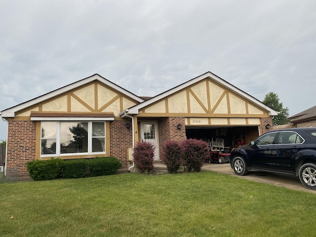 17212 Cottage Ct, Tinley Park, IL 60487 - tudor home featuring an attached garage, a front lawn, stucco siding, driveway, and brick siding