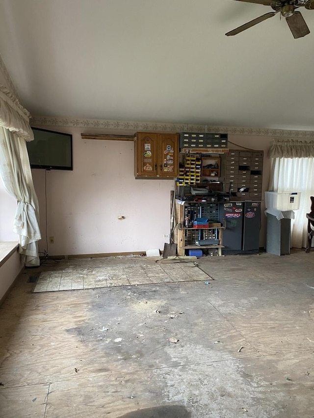 17212 Cottage Ct, Tinley Park, IL 60487 - unfurnished living room featuring ceiling fan and a workshop area