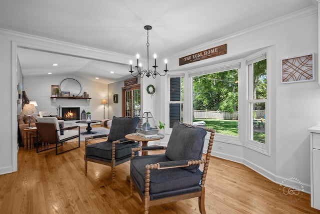 302 Carriage Hill Rd, Naperville, IL 60565 - dining area featuring a warm lit fireplace, vaulted ceiling, light wood finished floors, ornamental molding, and a chandelier