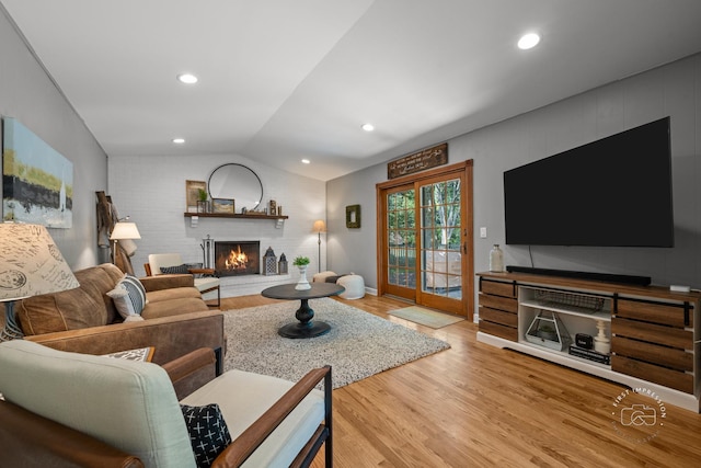 302 Carriage Hill Rd, Naperville, IL 60565 - living area with a fireplace, wood finished floors, and vaulted ceiling