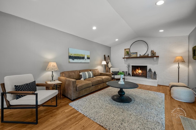 302 Carriage Hill Rd, Naperville, IL 60565 - living area with lofted ceiling, a brick fireplace, light wood-style flooring, brick wall, and recessed lighting
