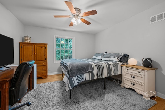 302 Carriage Hill Rd, Naperville, IL 60565 - bedroom with light wood-type flooring, a ceiling fan, and a desk