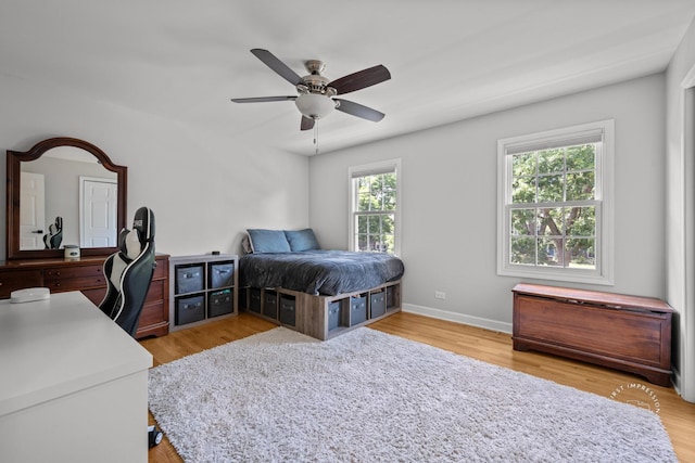 302 Carriage Hill Rd, Naperville, IL 60565 - bedroom with an office area, light wood finished floors, and a ceiling fan